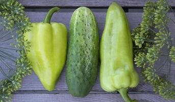 Vegetables in a row. Horizontal background from vegetables, flowers photo