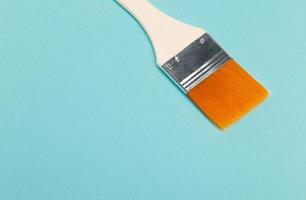 paintbrush isolated on blue background photo