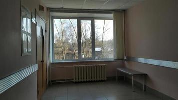 An empty dark corridor in the city clinic. photo