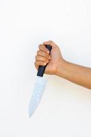 Hand of man hold dirty knife photo