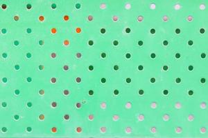 texture of dirty green metal with holes photo