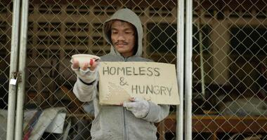 Homeless Person Holding Sign and Asking for Money video