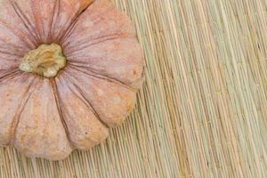 pumpkin on Thai traditional mat with copyspace photo