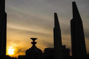 The Democracy Monument at twilight time at Bangkok photo