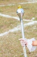 White Gloved Hand Holding Mace photo