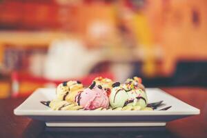 ice cream sundae vanilla strawberry chocolate lemon scoops with banana photo