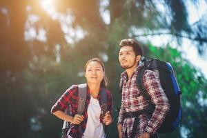 Young couple go adventure hiking together on vacation. photo