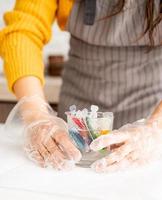 woman preparing to color easter eggs in the kitchen photo