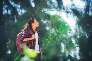 Young woman go adventure hiking on her vacation. photo