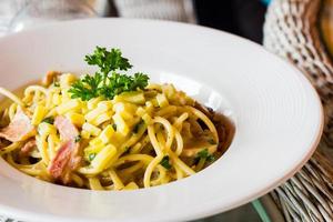 close-up spaghetti carbonara on dish photo