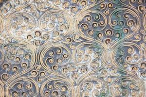 grunge golden spiral texture on the wall photo