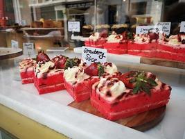 strawberry cake on a counter show window photo