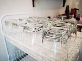 glasses of water on the shelf in coffee shop. photo