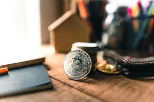 Bitcoin coins on a wooden desk photo