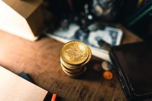 Bitcoin coins on a wooden desk photo