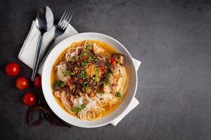 Rice noodles in fish curry sauce with vegetables