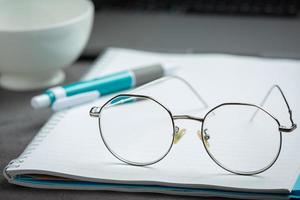 Glasses are placed on the ground of the world vision photo