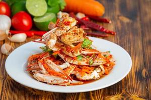 The blue crab salad is placed in a plate. photo