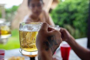 Beer party with friends at home, International Beer Day concept. photo