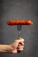 Sausage, with a fork photo