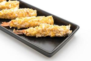 Batter-fried prawns on white background photo