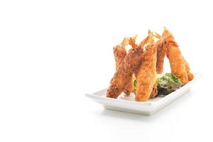 Batter-fried prawns on white background photo