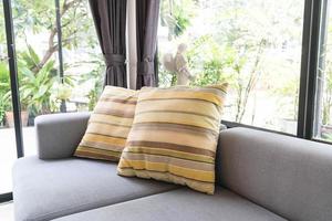 Beautiful pillow on sofa decoration photo