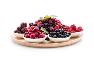 Frozen mixed berry on white background photo