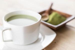 A cup of matcha latte green tea photo