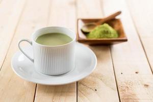 A cup of matcha latte green tea photo