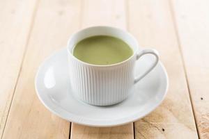 A cup of matcha latte green tea photo