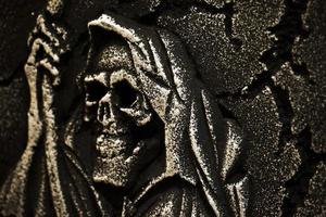 Scary Halloween Symbol Skull on Gravestone photo