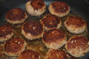 Fried meatballs with boiled broccoli and parsley potatoes photo