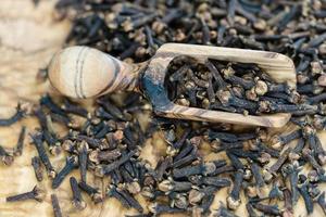 dried clove on olive wood photo