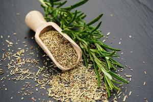 Rosemary Salvia rosmarinus and a wooden spoon photo