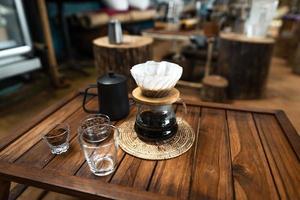 drip coffee on a wooden table at home photo