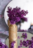 Background with copy space blank on table with lilac purple flower. photo