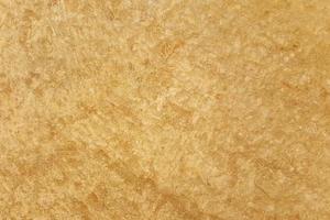 Brown adobe clay wall texture background. photo