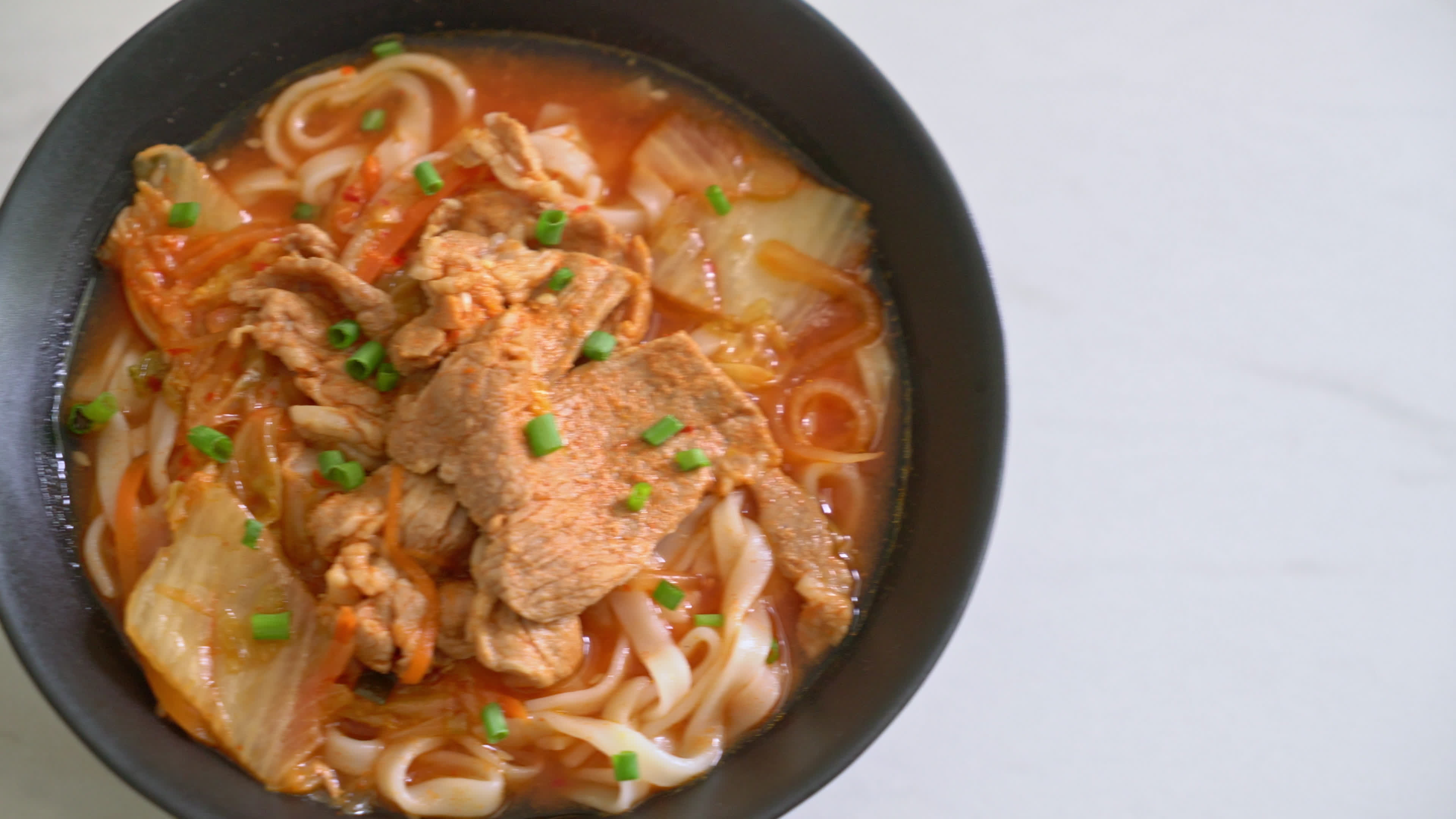 Korean udon ramen noodles with pork and kimchi Korean food style
