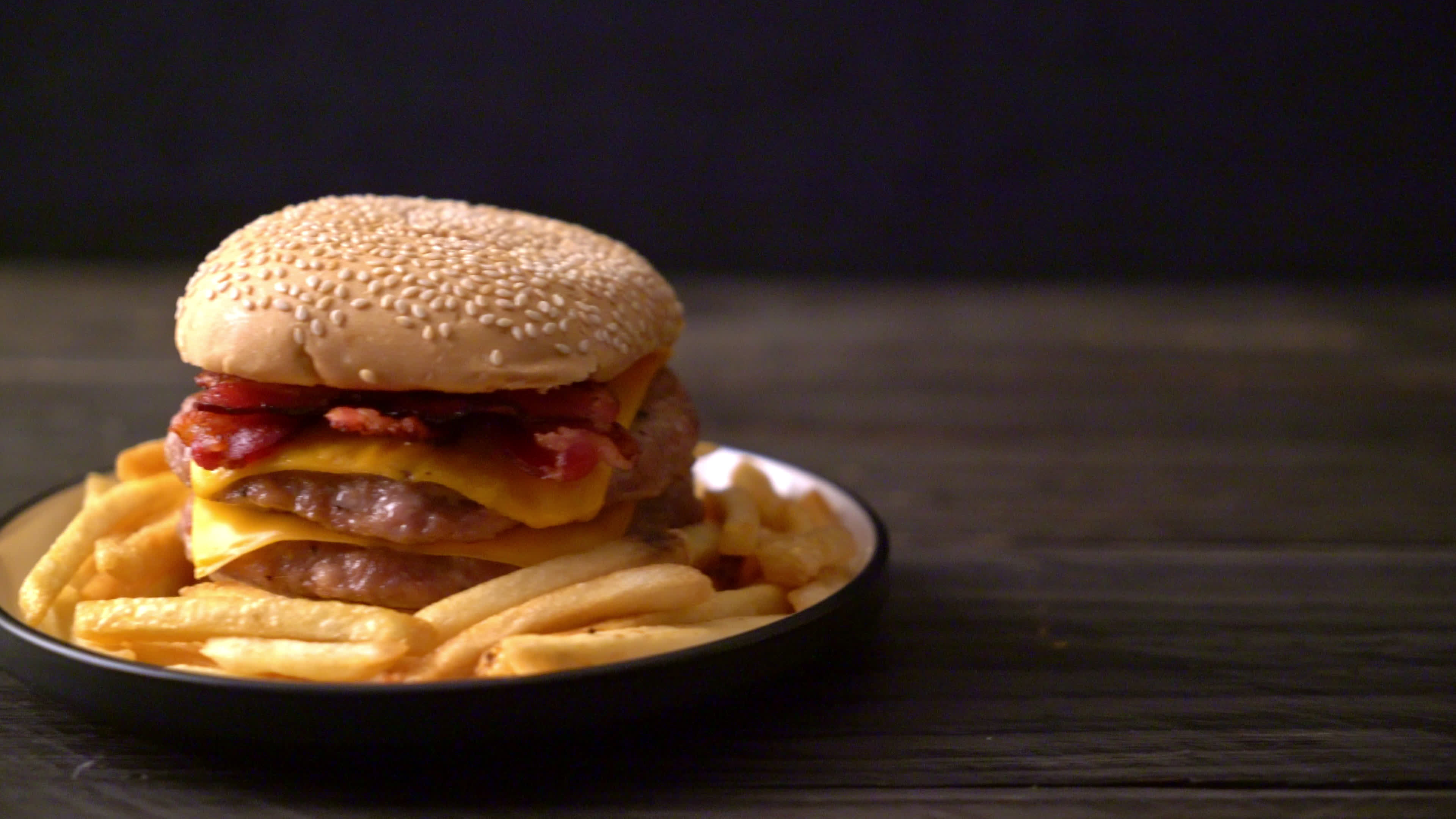 Pork burger with cheese and bacon 3104626 Stock Video at Vecteezy