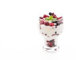 Yogurt with mixed berries on white background photo