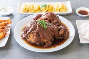 Stewed pork leg in gravy soup photo