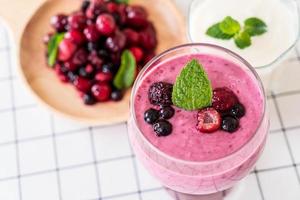 Mixed berries with yogurt smoothies on the table photo