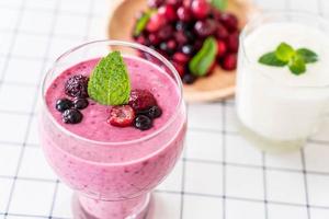 Mixed berries with yogurt smoothies on the table photo