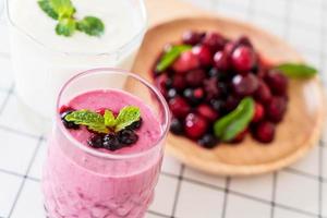 Mixed berries with yogurt smoothies on the table photo