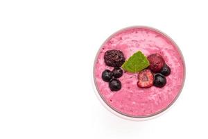 Mixed berries with yogurt smoothies on white background photo