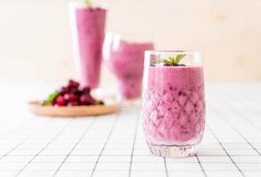 Mixed berries with yogurt smoothies on the table photo