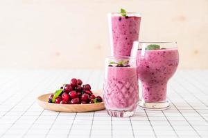 Mixed berries with yogurt smoothies on the table photo