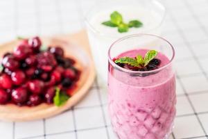 Mixed berries with yogurt smoothies on the table photo