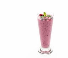 Mixed berries with yogurt smoothies on white background photo